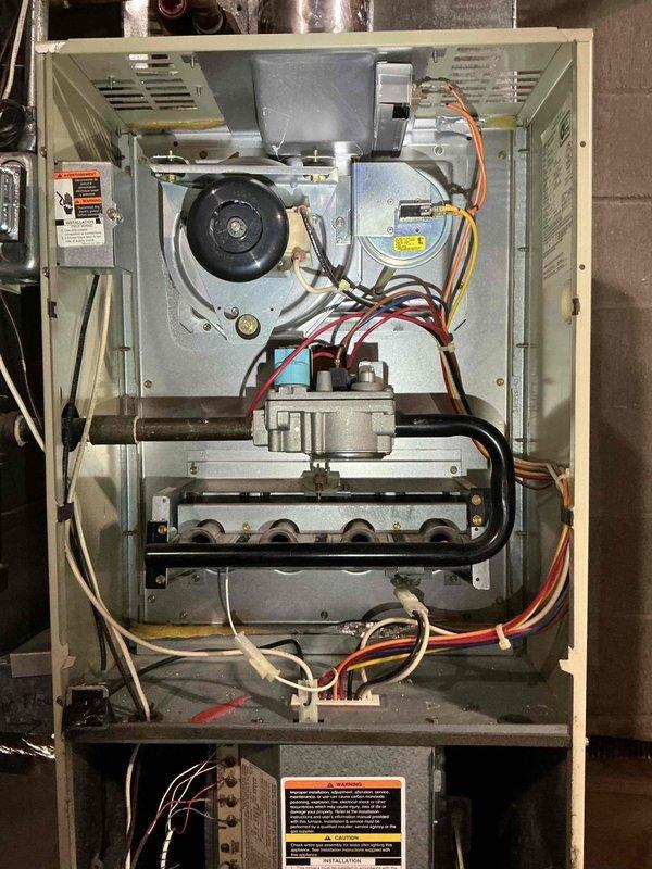 Performed comprehensive annual tune-up on 31-year-old Bryant furnace. Inspection revealed heat exchanger with temperature stress but no structural failures, functioning igniter and flame sensor, operational control board and good blower capacitor. Combustion analysis with Testo 310 confirmed clean burning efficiency (78.5%) with acceptable CO levels. Noted some dirt accumulation on blower wheel. System is operating safely and properly.