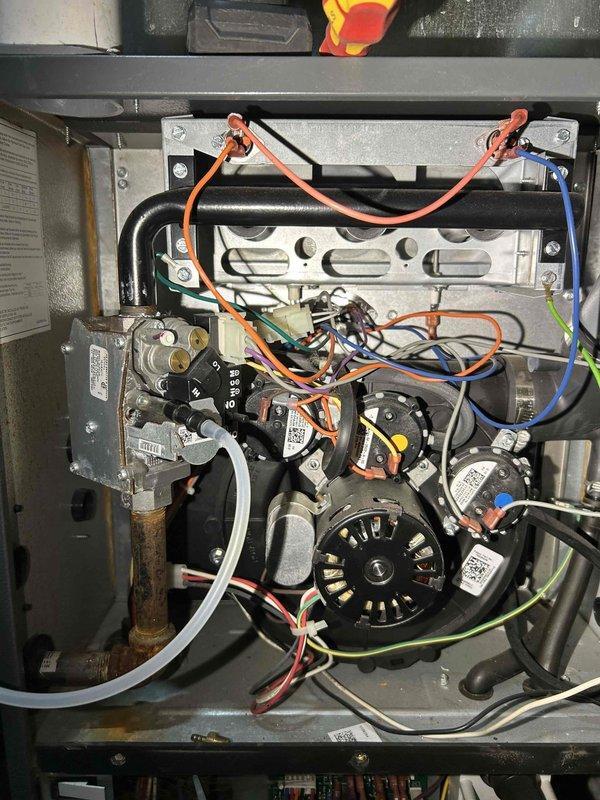 Performed annual furnace tune-up on 6-year-old system. Replaced extremely dirty air filter contaminated with smoke residue and soot-like deposits. Discovered rust buildup on heat exchanger and burners with water streaking. Adjusted excessively high gas pressure which successfully lowered carbon monoxide readings to acceptable levels. Cleaned flame sensor rod and verified proper heating operation.