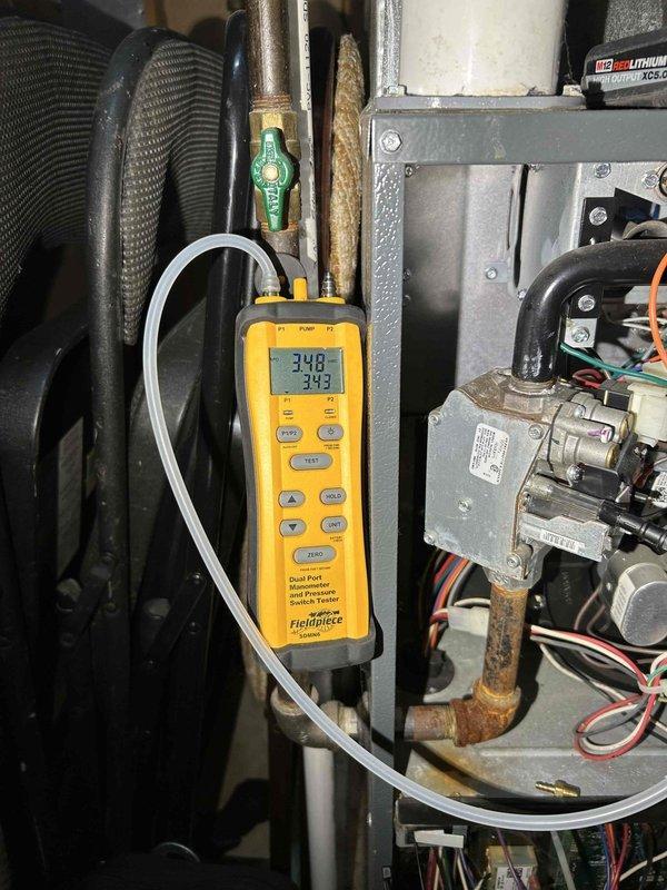 Performed annual furnace tune-up on 6-year-old system. Replaced extremely dirty air filter contaminated with smoke residue and soot-like deposits. Discovered rust buildup on heat exchanger and burners with water streaking. Adjusted excessively high gas pressure which successfully lowered carbon monoxide readings to acceptable levels. Cleaned flame sensor rod and verified proper heating operation.