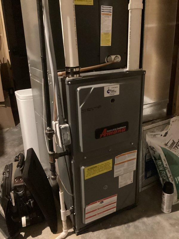 Performed furnace maintenance tune-up on an Amana system. Identified heavily clogged MERV 14 filter restricting airflow; adjusted high/low fire settings and verified proper temperature operation. Recommended switching to MERV 8 filters with replacement 2-3 times monthly to improve system performance and airflow. Noted homeowner's concern about cooling season performance issues to be addressed during next seasonal maintenance visit.