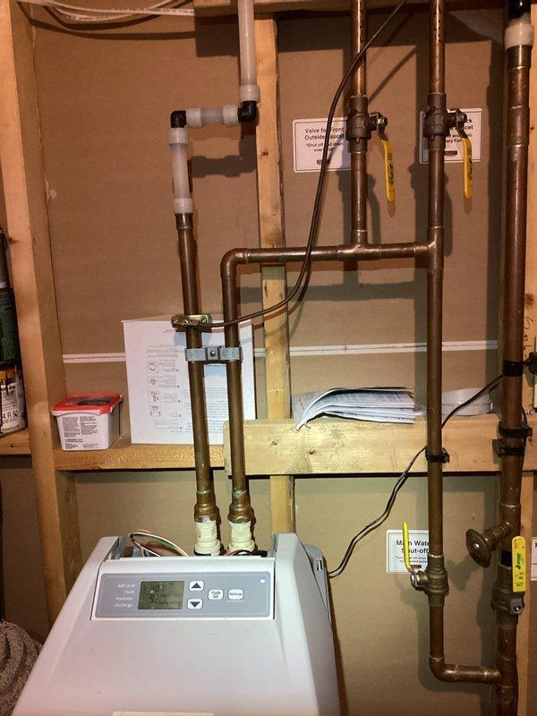 Responded to service call for water leak from customer's 12-year-old water softener. Diagnosed the unit was not cycling properly and leaking from the bypass valve. Also identified that the water heater was leaking from the relief valve. Performed replacement of water heater relief valve, installed new anode rod, and completed water heater flush. Customer opted to replace the water softener unit themselves with plans to have our team install it once purchased.