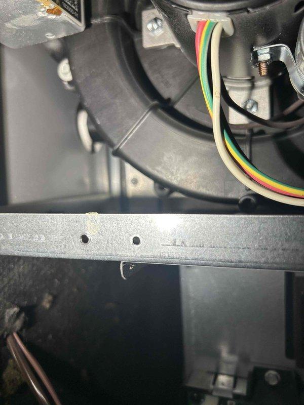 Responded to service call for water leakage under furnace. Upon inspection, found exhaust PVC tube disconnected causing condensate drainage and water pooling beneath electrical components and front panel. Reconnected exhaust tube to proper position, verified all electrical components were undamaged and functioning correctly. Thoroughly cleaned water from furnace panel, surrounding area, and floor to prevent potential damage.