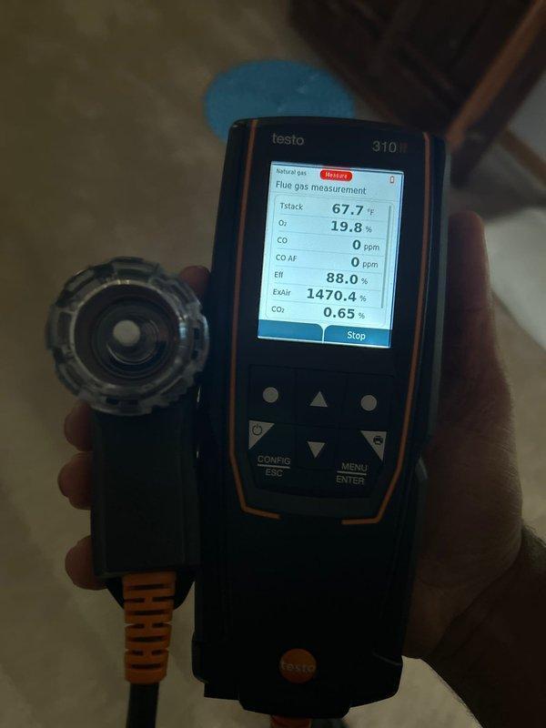 Responded to warranty call regarding gas odor from recently installed heat pump. Performed comprehensive diagnostic testing including gas leak detection, heat pump and furnace operation verification, and CO level measurement with Testo 310 analyzer (readings: 0 ppm CO, 19.8% O₂, 67.7°F stack temperature). Explained to customer that odor likely originates from manufacturing residues burning off during normal operation of new equipment.