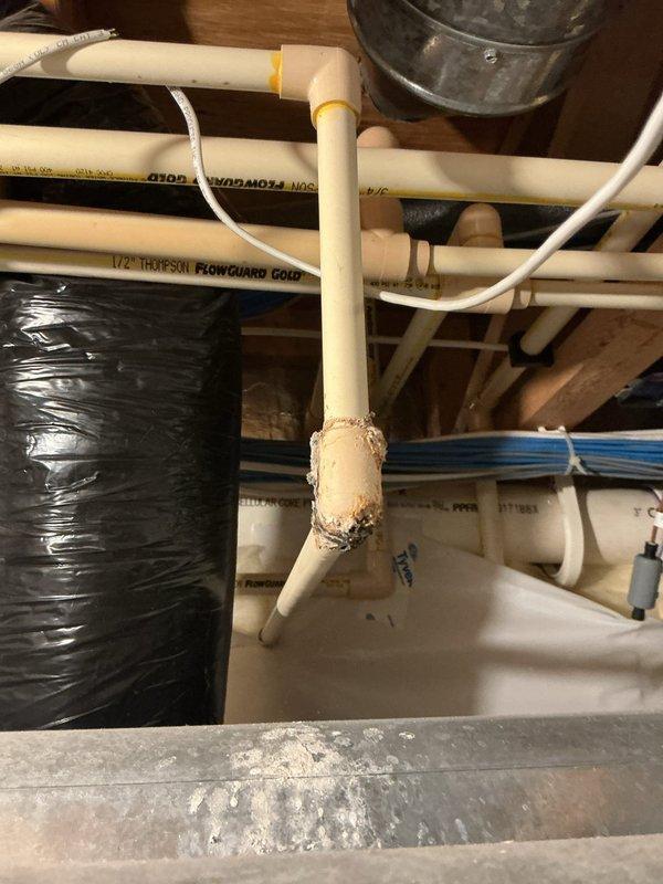Responded to service call for a leaking 50-gallon natural gas water heater (2016 model) exhibiting Fault Code 2 issues. Diagnosed failed pressure relief valve causing T&P discharge and damaged CPVC connections. Replaced faulty pressure valve and repaired compromised CPVC piping sections, restoring proper system operation and eliminating leakage.