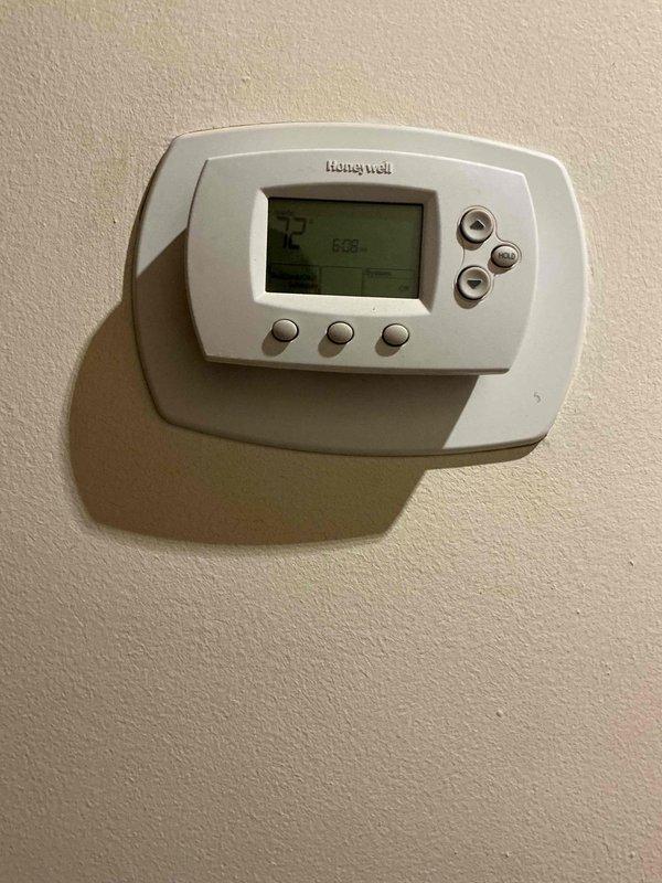 Diagnosed issue with 20+ year old Slant Fin boiler experiencing continuous operation. Located short in thermostat wire between aquastat relay and main floor thermostat, confirmed through continuity testing. Temporary solution implemented allowing customer to control system via breaker until return visit scheduled for replacement of 2-wire thermostat cable.