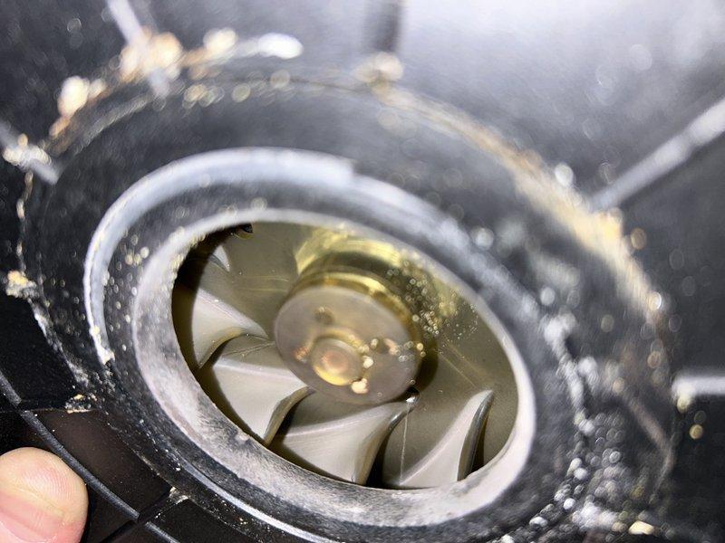 Diagnosed 20+ year old natural gas furnace with intermittent operation and insufficient heating. Inspection revealed inducer motor running hot with excessive amp draw due to cracked/damaged wheel assembly. Removed and inspected inducer assembly, confirming significant impeller damage with contamination present in housing. Recommended replacement of inducer assembly or complete furnace replacement based on equipment age and condition.