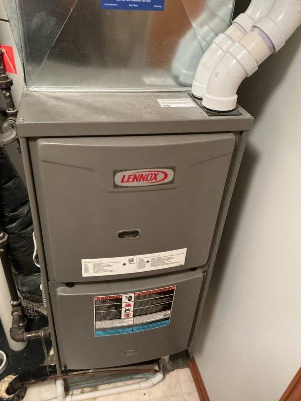 Responded to no heat call for 9-year-old Lennox furnace with pressure switch lockout (6 flashing lights). Upon arrival, furnace was operational with signs of possible condensate drainage issues. Cleared condensate trap and vacuumed excess water. Suspect prior temporary shutdown due to possible frost buildup on roof exhaust termination that had since melted. Confirmed system was functioning properly and providing heat before departure.