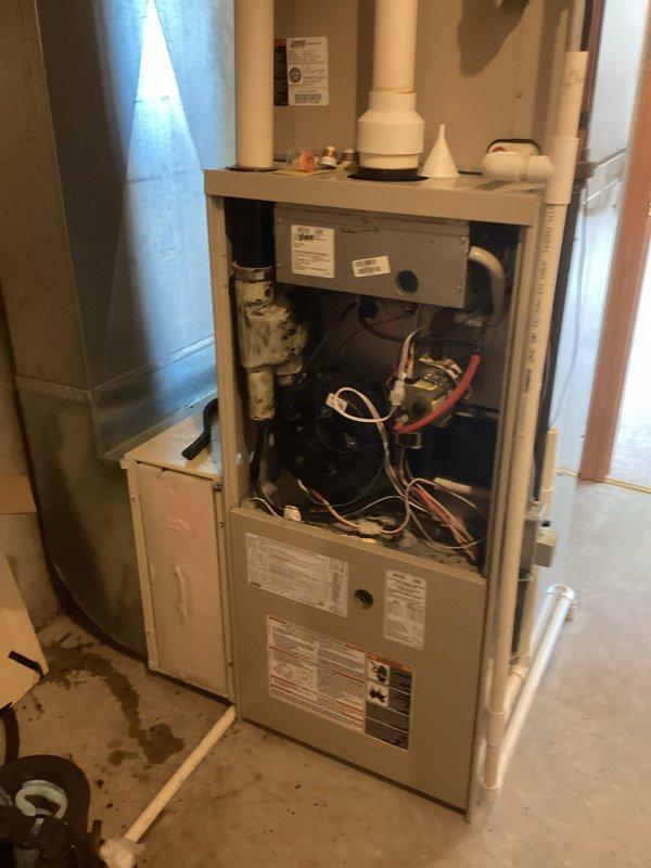 Responded to no-heat service call for aging furnace system. Diagnosed and cleared plugged condensate line, which was preventing proper operation. Performed heat exchanger inspection with no definitive defects found, though burners showed significant wear. System restored to proper heating function; customer was informed about potential future replacement considerations due to unit age and burner condition.