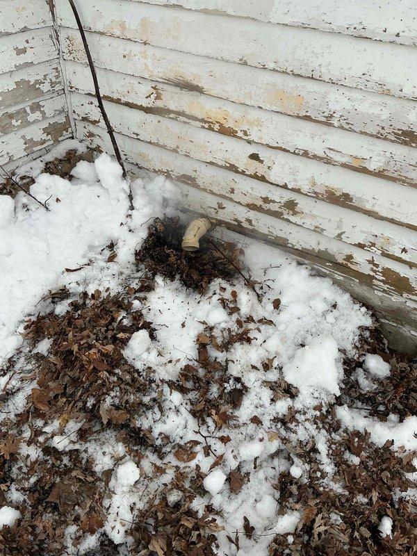 Diagnosed issue with 50-gallon natural gas power vent water heater shutting off repeatedly. Inspection revealed exterior exhaust termination was blocked by snow and leaf debris. Cleared obstruction from vent, restored proper ventilation, and confirmed unit firing and operating normally.