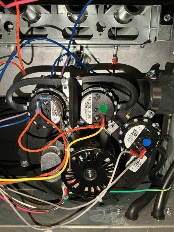 Responded to no-heat call for 1-year-old furnace that was attempting to cycle but failing to operate consistently. Diagnostic testing revealed error code EE2 on control board and a failed inducer motor. Replaced inducer motor under existing parts warranty, restoring normal furnace operation and heat to the home.