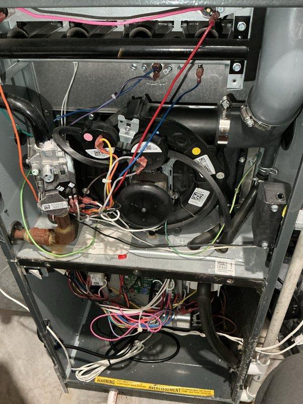 Shakopee, MN - Diagnosed furnace blowing cold air due to faulty flame sensor. System inspection revealed contaminated flame sensing rod preventing proper flame verification. Identified and showed customer the flame sensor issue, provided guidance on self-replacement as per customer's preference.