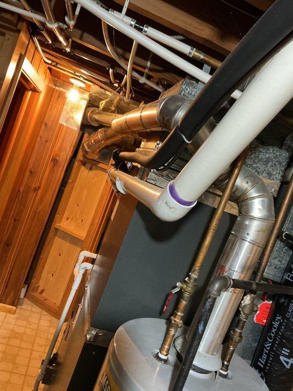 Responded to service call for water heater leakage in basement utility area. Diagnostic inspection revealed pooling water at base of unit. Replaced failed water heater tank with new unit, ensuring proper connections to existing copper and PVC supply lines and exhaust venting. System tested for proper operation and leaks before concluding service.