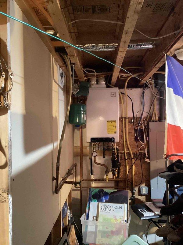 Responded to no heat complaint but identified actual issue was isolated to hot water supply in upstairs bathtub, not boiler-related. Verified water heater operational with both elements functioning properly and confirmed hot water available at other fixtures. Issue diagnosed as plumbing fixture problem; arranged for qualified plumber to address bathtub fixture repair.