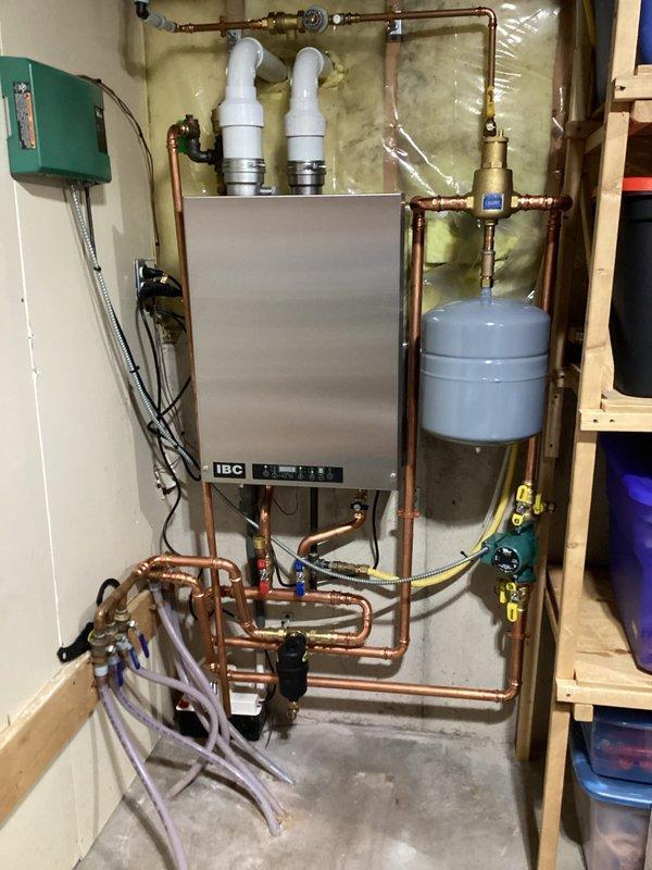 Performed comprehensive boiler maintenance service including disassembly and cleaning of heat exchanger, flushing system, and cleaning igniter. Inspected all components for proper operation, verified correct water pressure, and confirmed system specifications. System started successfully with proper warm air circulation. Customer was informed about membership options for future consideration.