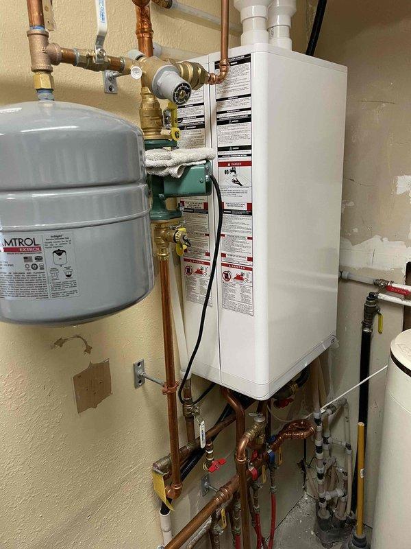 Pepin, WI - Performed complimentary tankless water heater descaling service and heat exchanger flush. System inspection revealed components in good condition. Discussed water treatment options with homeowner and scheduled water care advisor consultation for the following week.