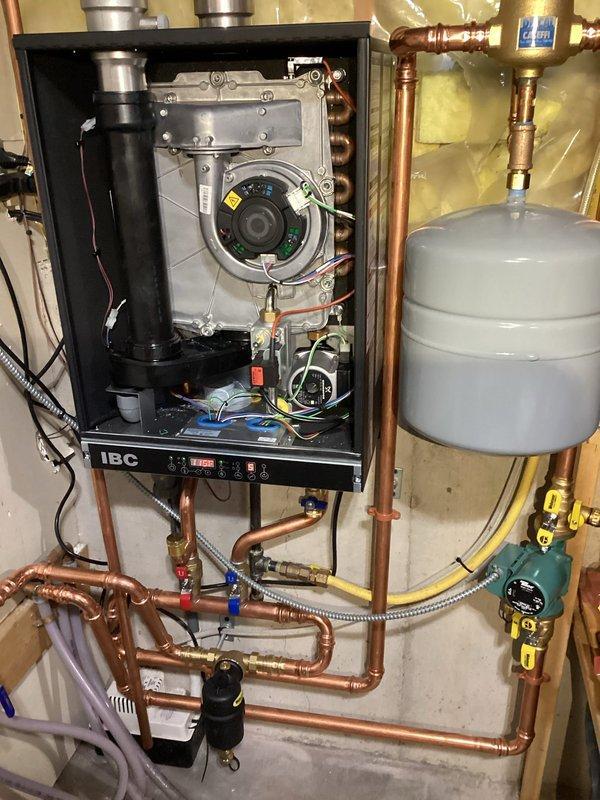 Fall Creek, WI - Diagnosed one-year-old IBC boiler that was running but not producing heat. Investigation revealed control board failure preventing internal pump operation. Replaced defective control board, restoring proper functionality to the heating system which had been previously serviced for cleaning approximately one week prior.