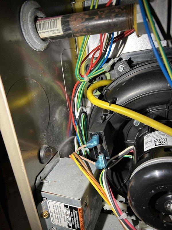 Returned to complete installation of PSC draft combustion inducer blower assembly on Bradford White water heater. Successfully installed and connected the inducer motor with proper electrical wiring, restoring normal operation to the unit's combustion system.