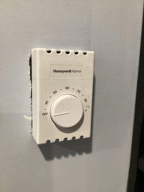 Responded to a no heat service call for high voltage baseboard heating system that was operating erratically and continuing to produce heat even when thermostat was turned off. Diagnostic testing of wiring, breaker, and thermostat control identified a faulty thermostat that was not properly cutting voltage when turned off. Replaced the manual Honeywell Home thermostat and verified proper system operation after installation.