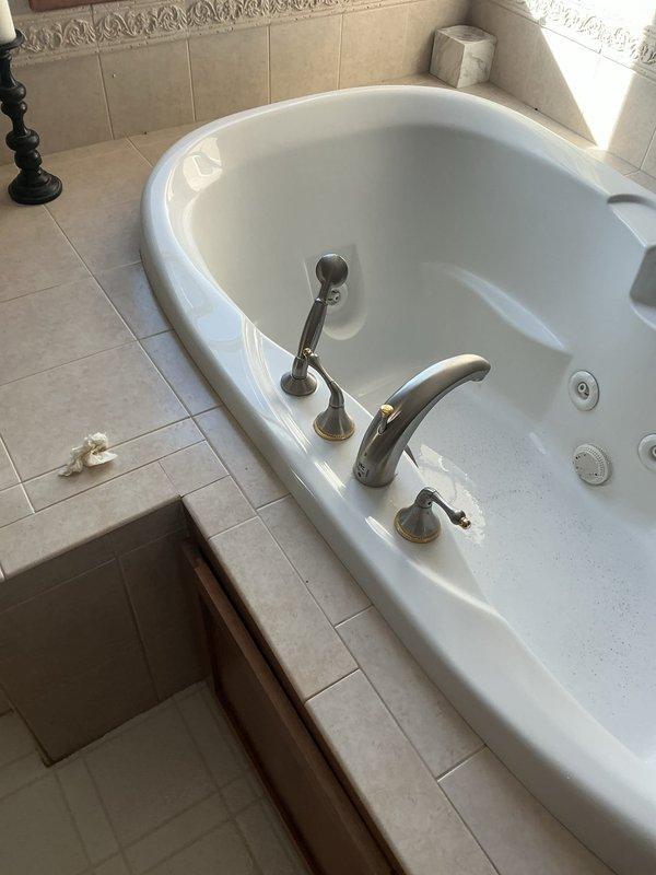 Responded to service call for multiple plumbing issues. Inspected and replaced faulty cartridge in jacuzzi tub shower handle to resolve leakage issue. Also addressed hallway bathroom faucet repair as part of home inspection corrections for property sale.