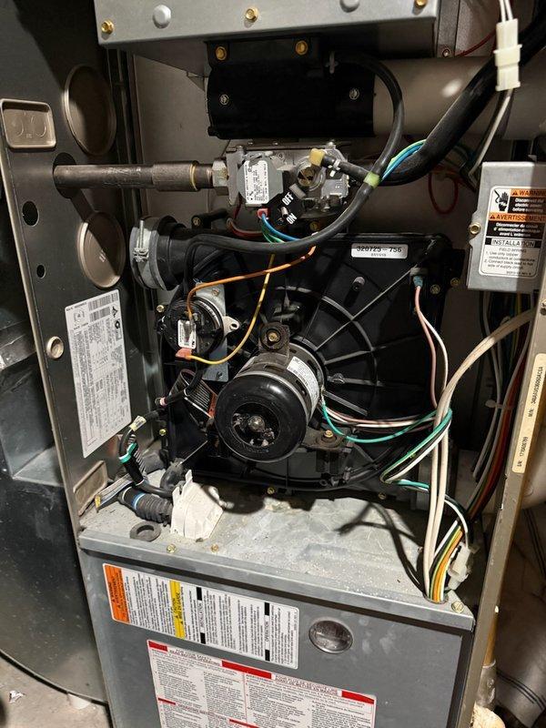 Diagnosed furnace with pressure switch fault code 31 and short cycling issues. Found clogged condensate trap causing system failure; cleaned and drained trap, reconnected PVC piping with adhesive. System operational upon completion; recommended future furnace replacement due to age and known heat exchanger issues with this model.