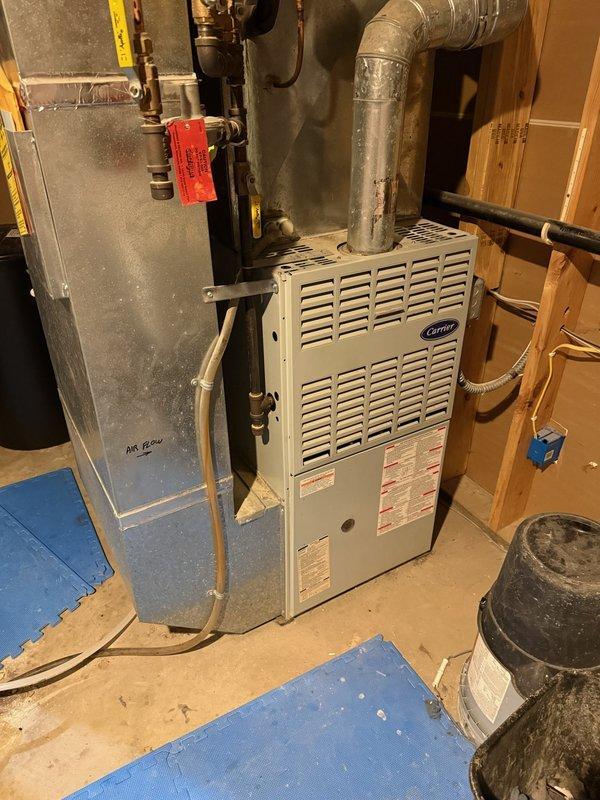 Diagnosed no heat complaint on 28-year-old Carrier furnace. Found inducer draft motor producing abnormal noise (squealing) and blower motor showing signs of oil leakage. Replaced both failed components to restore proper system operation. Completed visual inspection of heat exchanger and ductwork. System now operating within normal parameters.