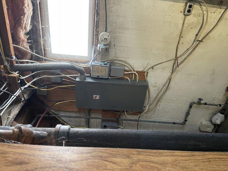 Responded to no heat call at residence with LP furnace. Found unit was switched off; restored power and verified operation, though evidence of limit switch activation observed due to heavily clogged filter. Discovered entire house was frozen including plumbing fixtures; thawed frozen condensate trap to restore proper drainage and temporarily disconnected frozen condensate pump. Advised customer to reconnect pump upon return and noted potential for significant plumbing issues once thawing occurs.