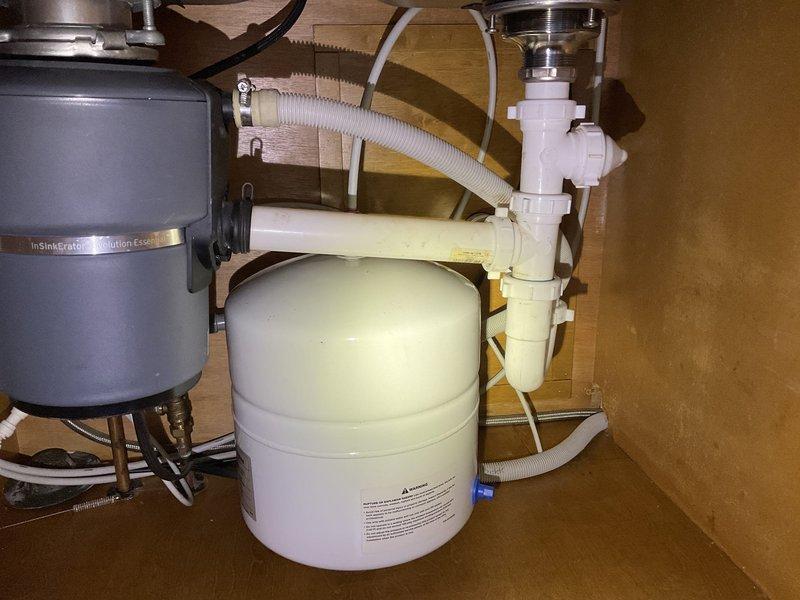 Responded to service call for kitchen sink drain not draining properly. Diagnosed issue as frozen kitchen drain piping rather than standard clog. Successfully thawed drain system using specialized homemade jetter equipment. Performed thorough flush of the drainage system to ensure proper flow was restored to the InSinkErator Evolution Excel disposal unit and associated P-trap assembly.