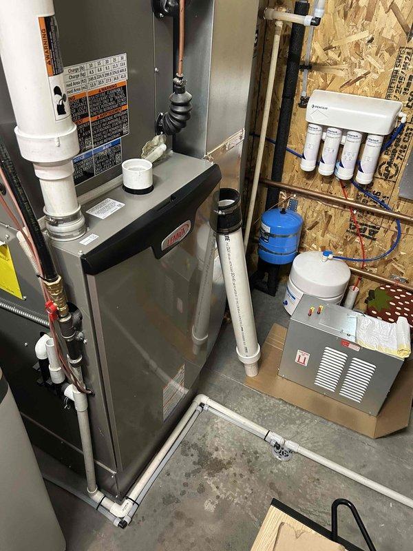 Responded to no heat complaint on recently installed furnace (2 weeks old). Found exhaust pipe frozen/blocked, which was causing GF collaboration error. Successfully freed the exhaust blockage and temporarily removed intake to restore heat. Customer is using supplemental wood burning stove. Recommended permanent solutions to prevent future exhaust freezing issues.