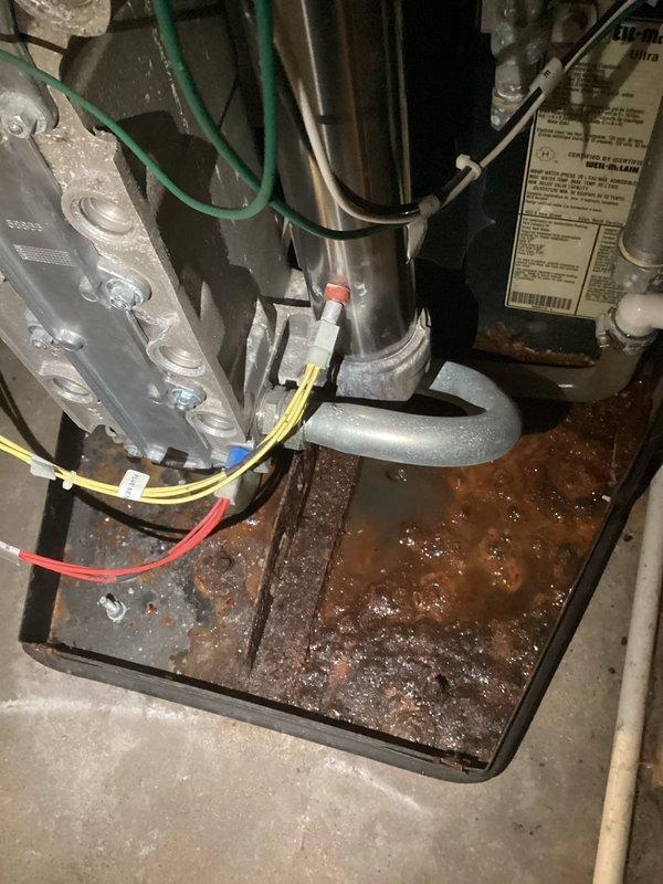 Responded to no heat call for 20-year-old boiler system. Upon inspection, detected carbon monoxide leakage (40-45 ppm) at the heat exchanger, indicating unsafe operating conditions. Cleaned flame sensor and temporarily restored ignition, but recommended immediate system shutdown due to compromised heat exchanger integrity and advanced equipment age. Scheduled replacement consultation as repair not advisable given system condition and safety concerns.