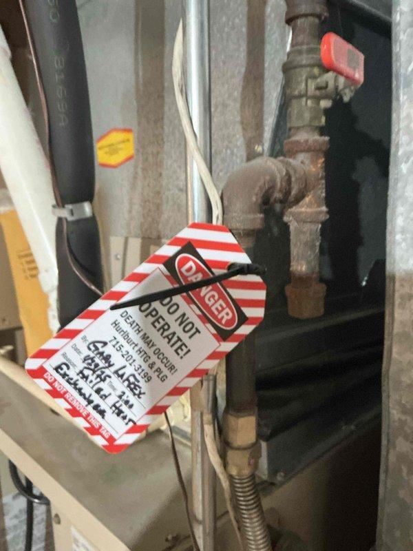 Woodville, WI - Diagnosed no heat condition on 33-year-old Lennox pulse furnace. Found failed spark ignition system with no replacement parts available due to equipment age. Applied safety tag to system and recommended consultation with comfort advisor regarding replacement options.