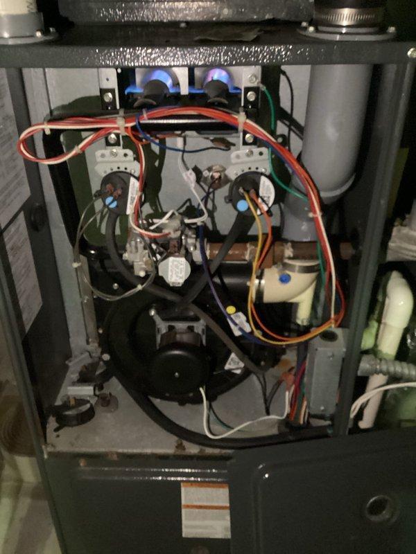 Responded to no heat call for an aging residential furnace located in a commercial building. Diagnostic testing revealed faulty ignitor preventing proper system operation. Replaced ignition component, restoring heat function. System returned to normal operation after repair.