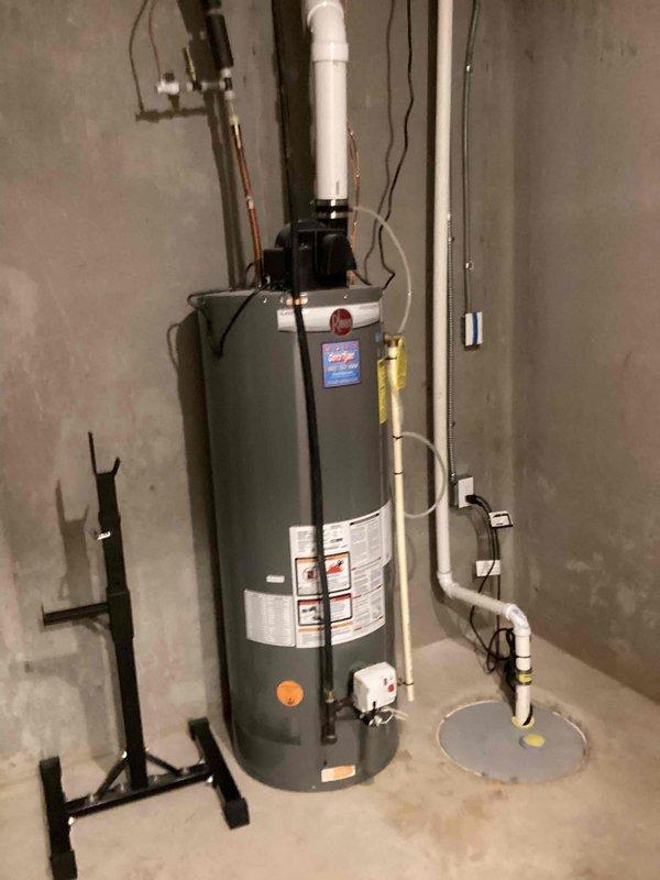 Responded to warranty service call for previously installed sump pump that was tripping breaker with ground fault error code. Determined sump pump was drawing excessive amperage (4 amps) and found flexible discharge line was frozen and still connected, causing operational issues. Disconnected discharge line to restore proper function.