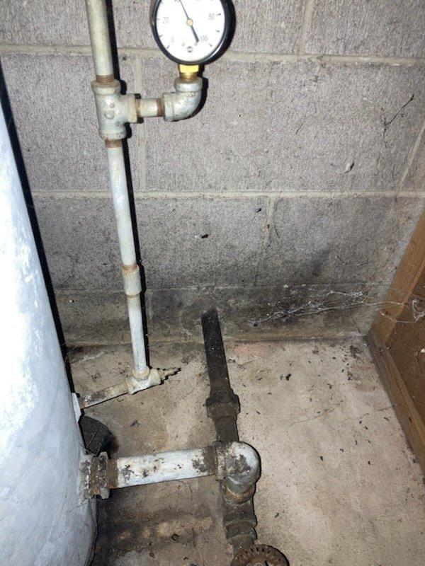 Replaced customer's aging pressure tank with new Myers Air Guard model and installed code-compliant upgrades to the plumbing system. Verified proper pressure gauge operation and inspected connections for leaks after installation. Customer advised this is a vacation property requiring advance notice for future service visits.