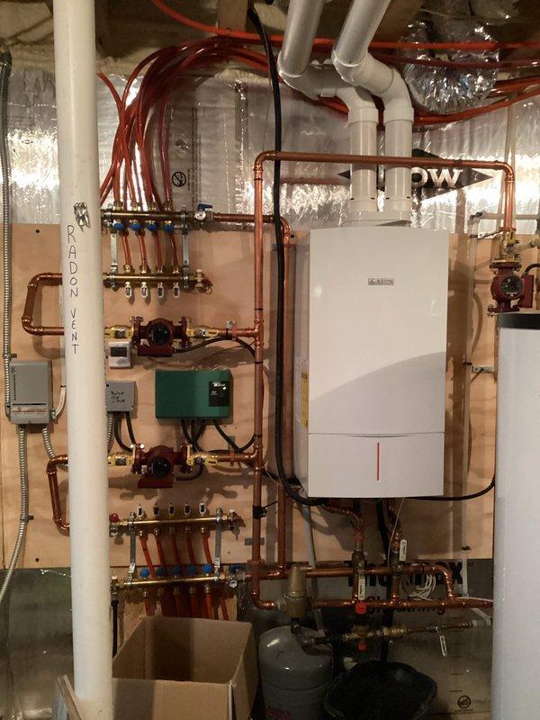 Responded to boiler shutdown due to ignition failure. Diagnosed low water pressure caused by plugged backflow preventer preventing auto-fill operation. Restored system operation by adding water, then replaced both backflow preventer and auto-fill valve to ensure reliable system function and prevent recurrence.