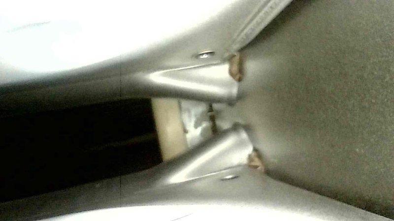 Responded to service call for 26-year-old natural gas furnace producing abnormal noise. Diagnostic inspection revealed failing inducer motor assembly as the source of the noise issue. Presented customer with options to either replace the inducer motor component or consider full system replacement due to the unit's advanced age and potential for additional failures.