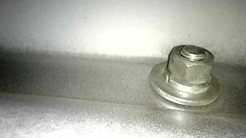 Responded to service call for 26-year-old natural gas furnace producing abnormal noise. Diagnostic inspection revealed failing inducer motor assembly as the source of the noise issue. Presented customer with options to either replace the inducer motor component or consider full system replacement due to the unit's advanced age and potential for additional failures.