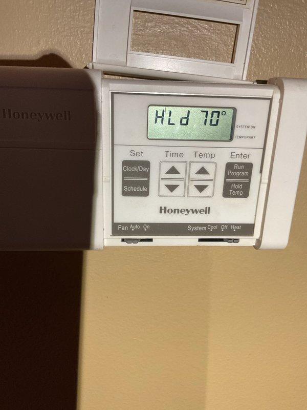 Completed furnace tune-up and system inspection on aging HVAC equipment. Discovered evaporator coil heavily plugged with debris with no accessible cleaning port. Measured supply/return air temperature delta ranging from 35-65 degrees with system running in high 70s, indicating reduced efficiency. Verified blower speed tap settings at thermostat. Documented equipment condition with photos including thermostat display showing hold temperature of 70 degrees. Discussed age and condition of existing equipment with homeowner, including water heater concerns being addressed separately by plumber. Homeowner declined advisor visit for full system replacement quotes at this time due to short-term occupancy plans but remained open to future estimates. Recommended monitoring system performance given compromised evaporator condition and overall equipment age.