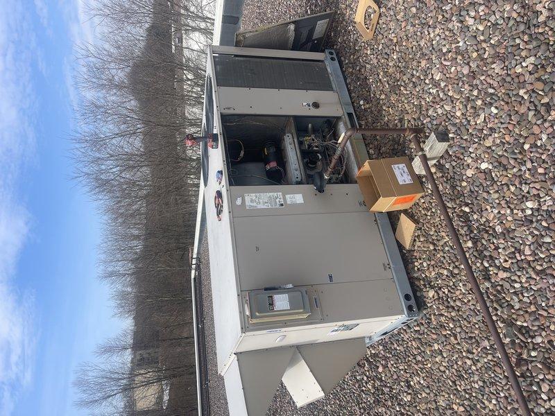 Replaced failed draft combustion inducer assembly on commercial heating unit. Removed old inducer motor, installed new draft inducer assembly with all necessary electrical connections, and verified proper operation of the system. Unit tested and confirmed functioning correctly with appropriate draft pressure and combustion cycle operation.