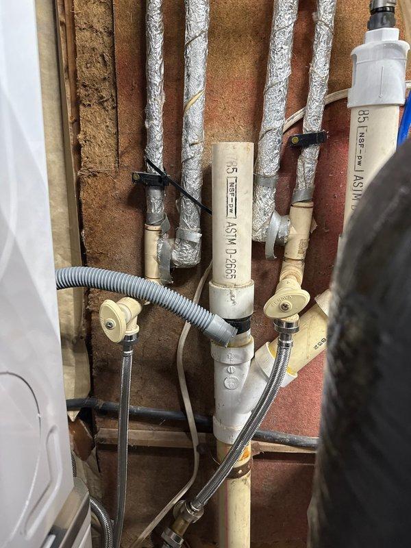 Responded to leaking CPVC shut-off valves on washing machine water supply lines. Removed failed valves and installed new replacement shut-offs to eliminate active leaks and restore proper water control functionality to the appliance.