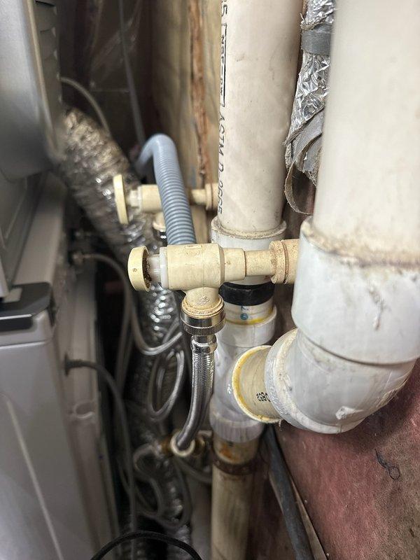 Responded to leaking CPVC shut-off valves on washing machine water supply lines. Removed failed valves and installed new replacement shut-offs to eliminate active leaks and restore proper water control functionality to the appliance.