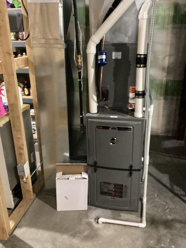 Conducted furnace tune-up on 8-year-old FR furnace system. Replaced humidifier pad, verified all electrical components within specification, cleared condensate lines, and inspected heat exchanger (no compromises found). Also serviced hanging unit in garage, noting stress on heat exchanger back bends but no operational issues. Both systems demonstrated proper operation with appropriate temperature rise and gas pressures during extended testing.