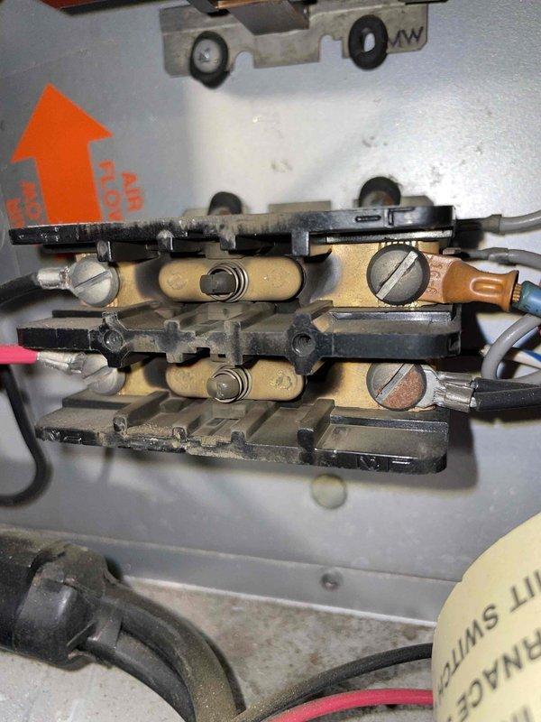 Responded to no-heat complaint on dual electric/oil furnace system. Diagnosed failed electric plenum heater with burnt contactors and 24V coils as confirmed by visual inspection. Customer has been relying on oil furnace for heat. After discussing repair options, customer elected to discontinue electric heating repairs in favor of converting to LP due to high utility costs from electric heat usage. Scheduled advisor visit for LP conversion consultation.