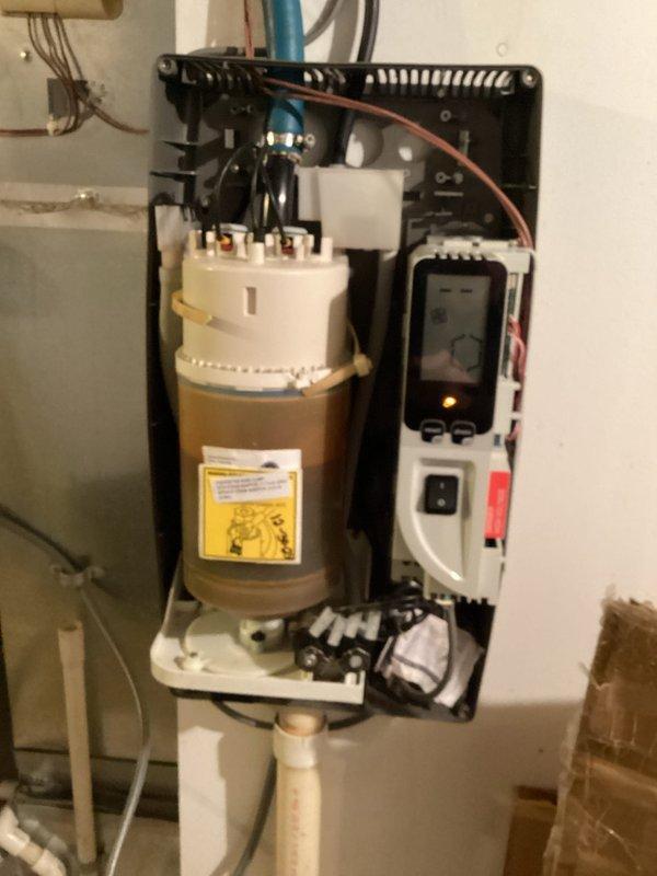 Osseo, WI - Performed scheduled maintenance on geothermal system including temperature readings, pressure verification, and component inspection with all systems functioning properly. Conducted thorough inspection of G32 gas furnace including heat exchanger examination, flame sensor and condensate cleaning, with no defects identified. Serviced steam humidifier which exhibited frequent flushing cycles due to ongoing water conductivity issues, and performed maintenance on separate oil furnace including nozzle and filter replacement.