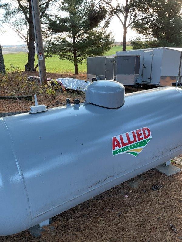 Completed annual HVAC maintenance on 19-year-old gas furnace for new customer. Inspected heat exchanger which appeared in acceptable condition despite age, with evidence of previous repairs. Noted adjacent 80-gallon water heater with visible leak dripping onto floor from pedestal. Customer scheduled follow-up appointments for equipment replacement quotes for both HVAC and plumbing systems.