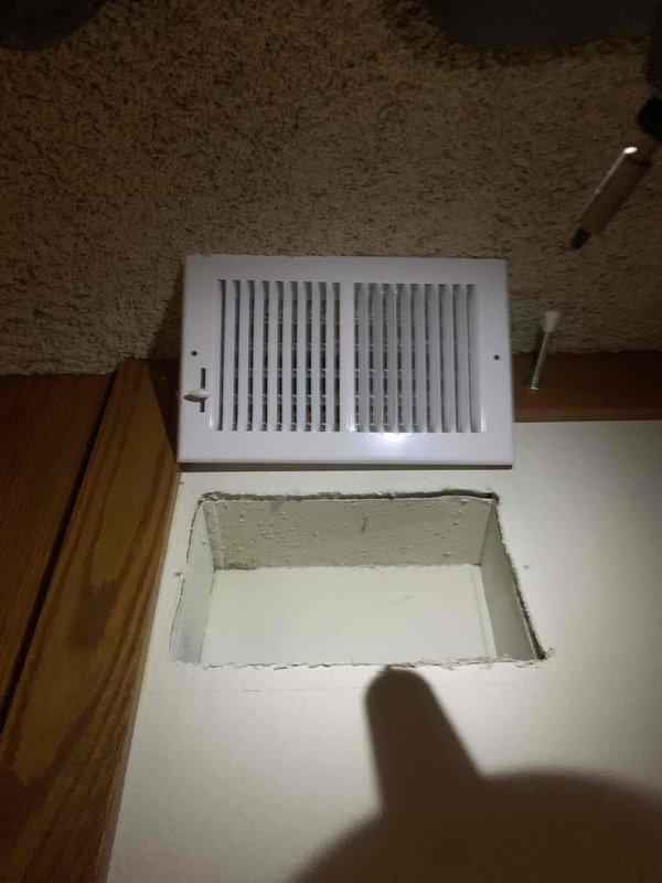 Completed duct cleaning service as part of installation package. Inspected and cleaned ductwork connected to wall-mounted air vents, ensuring proper airflow and system efficiency. Verified installation integrity of rectangular metal vent access points throughout the home.