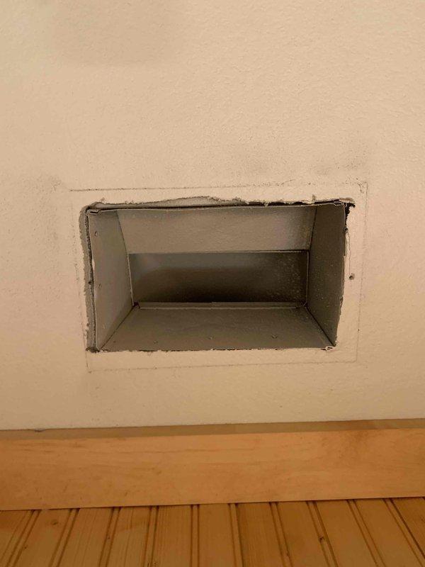 Completed duct cleaning service as part of installation package. Inspected and cleaned ductwork connected to wall-mounted air vents, ensuring proper airflow and system efficiency. Verified installation integrity of rectangular metal vent access points throughout the home.