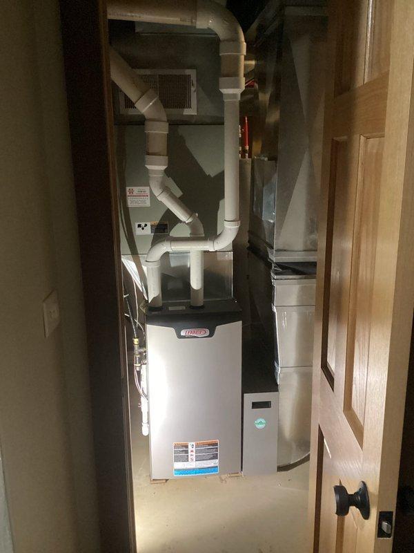 Performed annual furnace tune-up on 2-year-old FRP heat pump system. Replaced dirty humidifier pad and filter. Inspected all components including blower (clean and balanced), electrical components (within spec), condensate lines (clear), and heat exchanger (no compromises). System operated normally during 15-minute test run with 60-degree temperature rise. Reviewed whole home dehumidifier operation with customer per their request.
