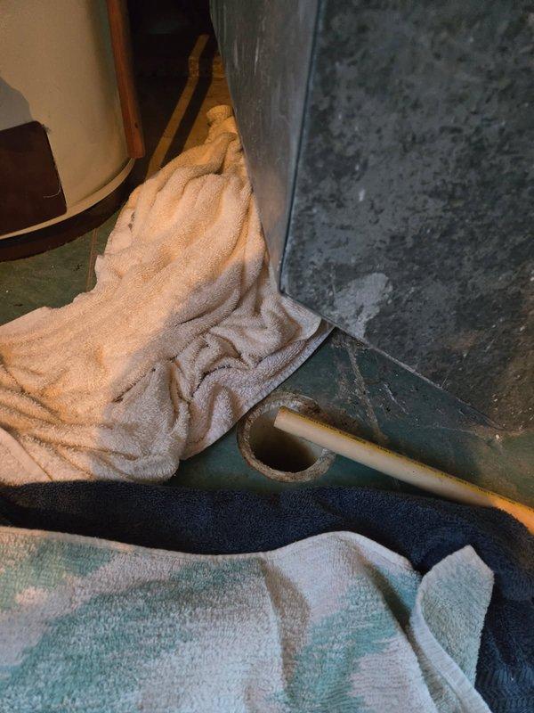 Responded to service call for non-functional sump pump affecting downstairs fixtures. Diagnosed issue as a stuck float mechanism. Resolved problem by connecting hose and thoroughly cleaning the float assembly, restoring proper pump operation.