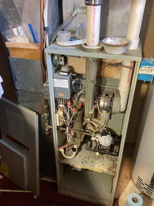 Responded to no heat call for 20+ year old LP boiler system. Upon inspection, confirmed customer's report of failed blower motor and identified a suspected crack in the heat exchanger. Customer was informed that unit is at end of life and replacement is recommended rather than repair. Advisor scheduled to provide replacement options.