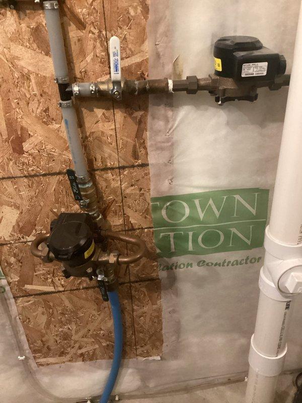 Performed routine maintenance on 6-year-old AO Smith 50-gallon power vent water heater. Completed thorough system flush with clear water discharge observed, indicating minimal sediment buildup. Inspected flame pattern and cleaned components, confirming proper operation despite hard water conditions evident from shower head stains.